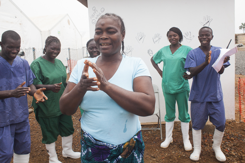 During her discharge, Hawa Kargbo,celebretes together with nurses, hygienists and the psychosocial team, that she could survive to the Ebola Virus Desease. Ebola Treatement Center. Moyamba. Sierra Leone.